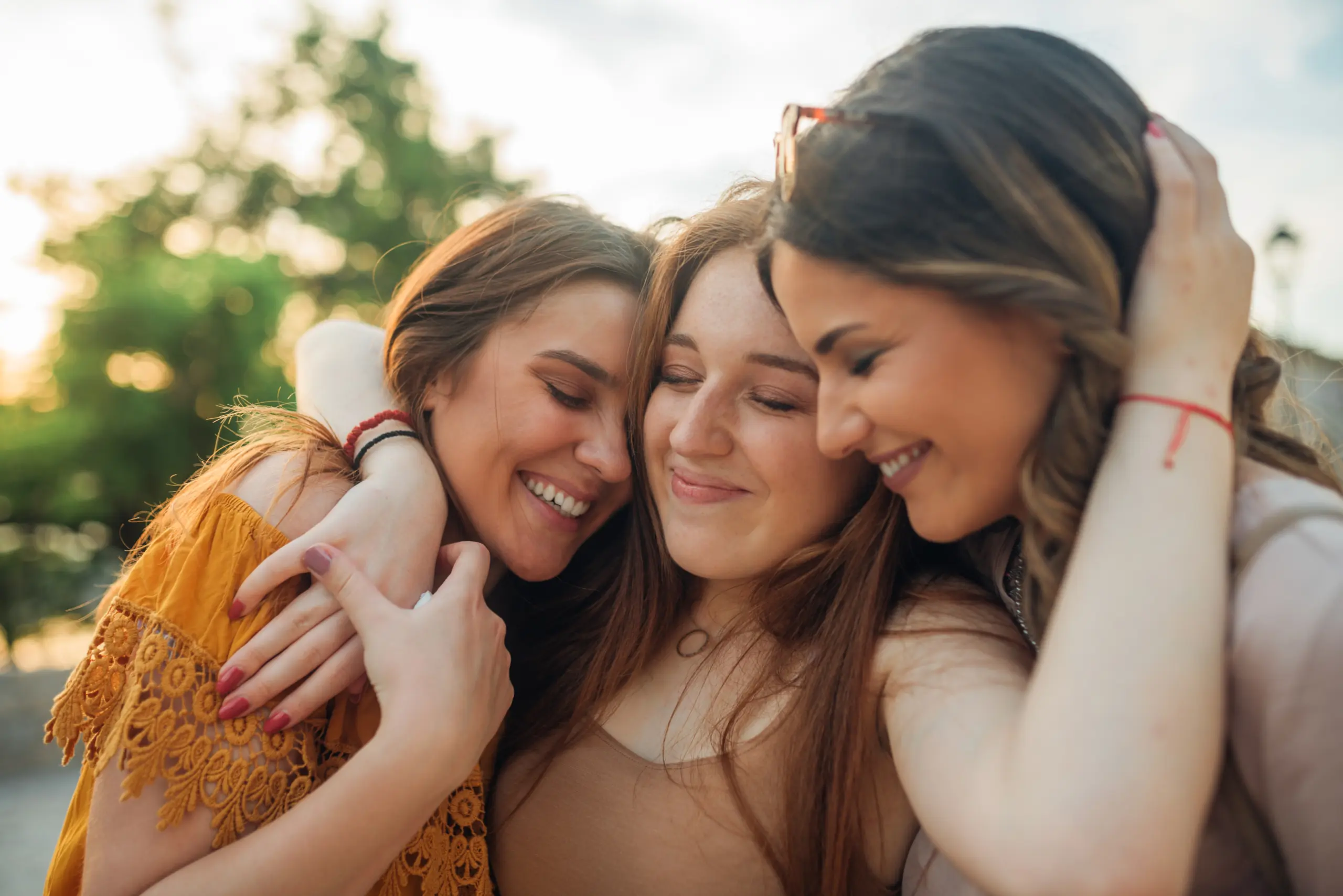 Friends hugging Programs & Services